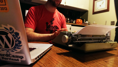 John writing on a typewriter