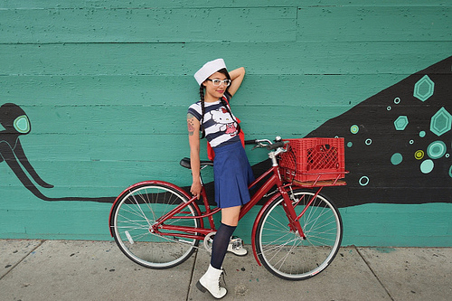 Sailor Hipster Girl on a Fixie Bicycle