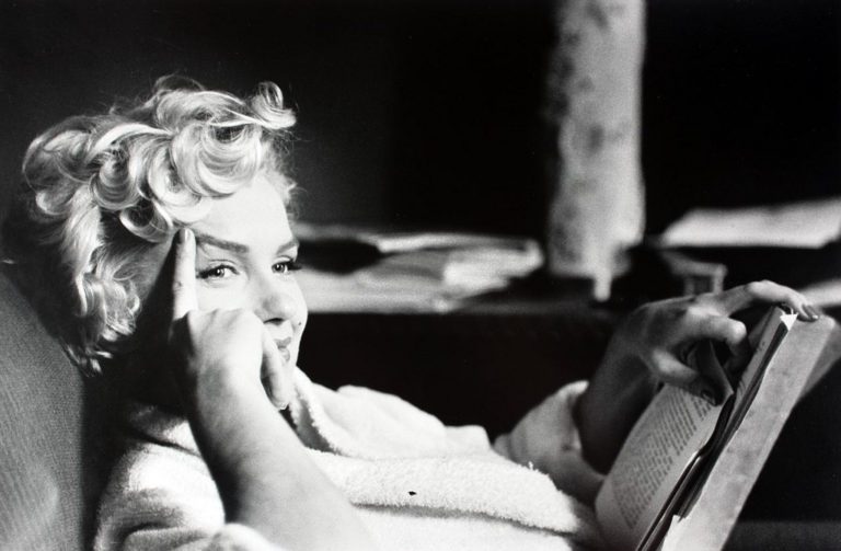 Marilyn Monroe reading, by Elliott Erwitt, 1956